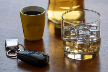 alcohol abuse with glass of whiskey with ice
