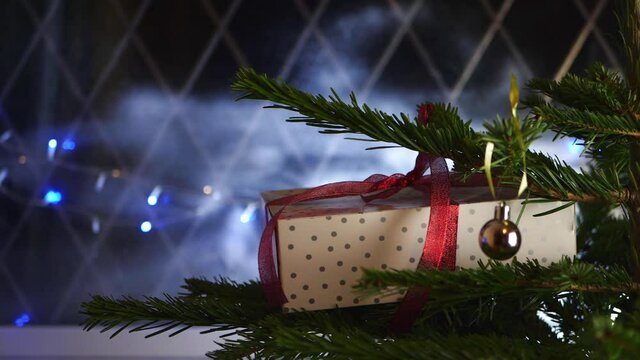 Christmas gift with bokeh lights background