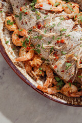 Close up of creole style snapper and shrimp