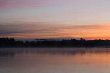 Fototapeta na wymiar Bluish-Orange Mist on Lake