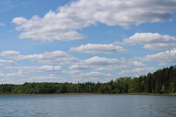 Blue Minnesota Lake with Fluffy White Clouds