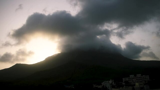 Beautiful view of clouds and fog on top of Girnar mountain during sunrise