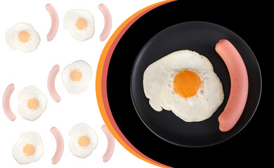 Fried egg and sausage on a black plate on a black background, place under the text on a white background