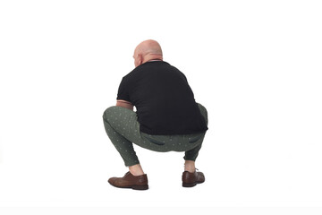 rear view of a man sitting squatting on white background