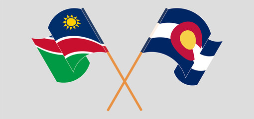 Crossed and waving flags of Namibia and The State of Colorado