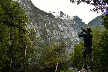 person photographing on a mountain