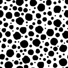 Fototapeta premium Black Dots and spots of various sizes in a chaotic manner on a white background, seamless pattern. Modern stylish texture. Monochrome minimalist graphic design.