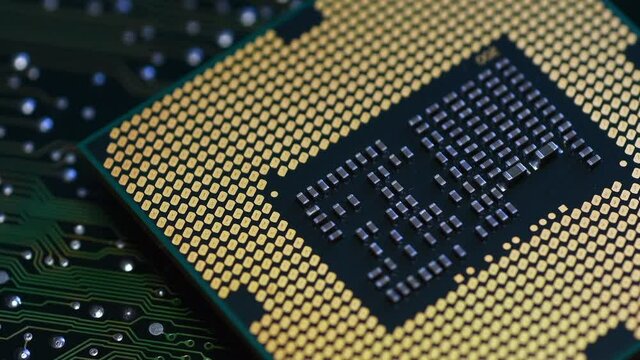 Detail of CPU Computer Processor on green electronic printed circuit board