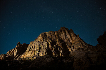 Fototapeta na wymiar Tre Cime di Lavaredo Peaks during night with stars in background