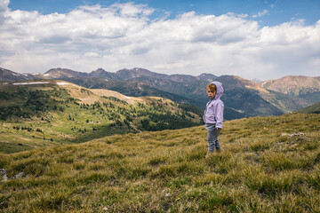 Naklejka na ściany i meble Young girl enjoying the Colorado mountains