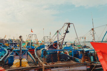Indian wooden body fishing boats docked after work in dockstation gangolli, karnataka, India