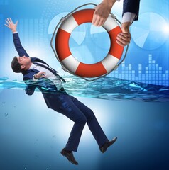 Businessman being saved from drowning