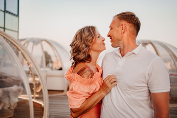 happy, beautiful man and woman in love in original place for dating on rooftop