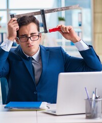 Stressed businessman thinking of suicide due to excessive worklo
