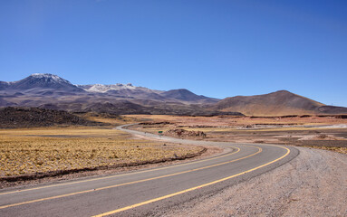 Driving through the amazing landscape of the Salar Aguas Calientes, Atacama Desert, Chile