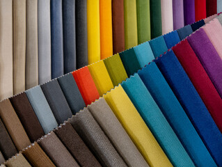 Catalog of bright colorful fabric samples for furniture manufacturing. Furniture fabric collection