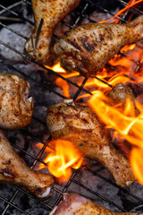 BBQ Chicken Drumstick on Grill Fire