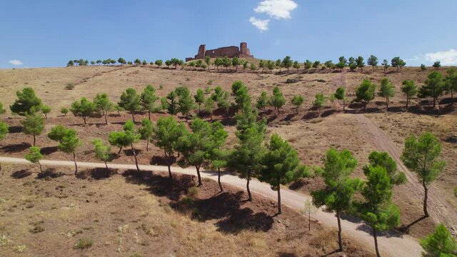 IX century castle in Almonacid de Toledo a small town in Castilla la Mancha. Drone going up and forward