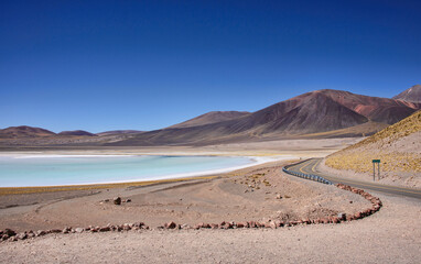 Fototapeta na wymiar Driving through the amazing landscape of the Salar Aguas Calientes, Atacama Desert, Chile