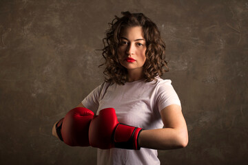 a boxer female in red boxing gloves, a feminist