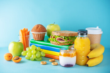 Healthy school lunch with a sandwich, fresh fruits and juice