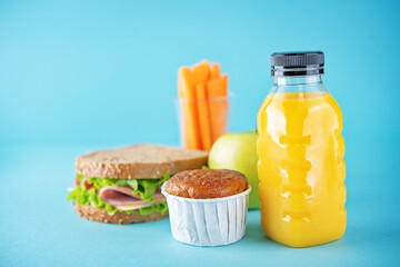 Healthy school lunch with a sandwich, fresh fruits and juice