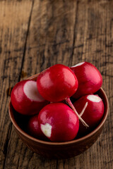 fresh red radish at on a rustic table top