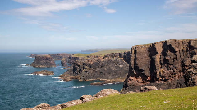 Shetland Eshaness Cliffs rugged coastline in sunny conditions