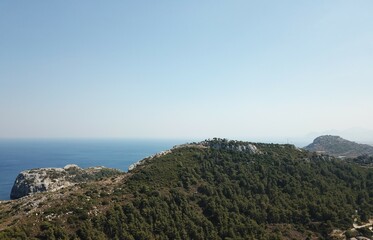 Greek mountains with blue sea in the background aerial drone photography