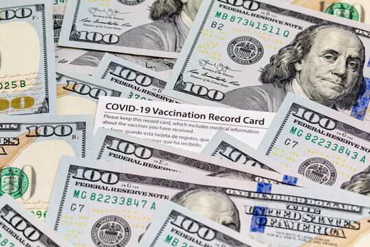 Covid-19 Vaccination Card And Cash Money. Covid Vaccine Lottery, Bonus And Incentive Concept