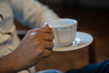 person holding a cup of coffee 