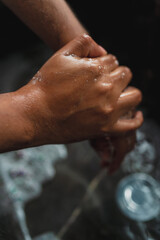 Fototapeta premium washing hands with water and soap