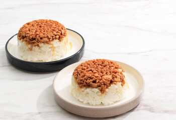 Homemade Nasi Tim Ayam, Steamed Rice with Diced Chicken Soy Sauce. Indonesian Comfort Food for Breakfast