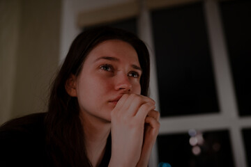 Woman crying at night at home