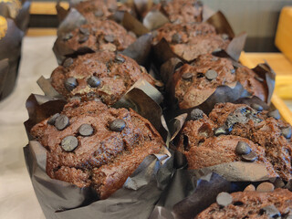 Tasty of cup chocolate chip cake on the bakery shelf at the cafe and coffee bar. Shoot with selective focus and blurred area.