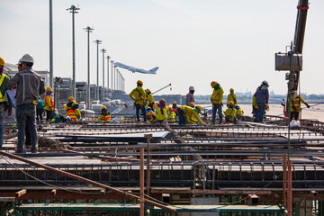 Naklejka premium Construction industry engineer foreman standing orders airport
