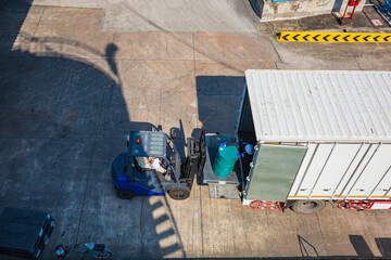 Oil barrels forklift truck move for on the transportation truck
