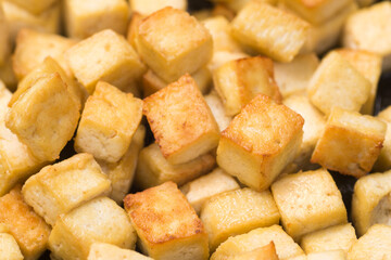 fried tofu pieces closeup selective focus