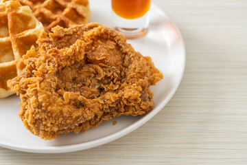 fried chicken waffle with honey or maple syrup
