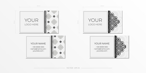 Vector preparation of business cards in white color with magnificent vector patterns of mandala ornaments. Template for print design business card with monogram patterns.