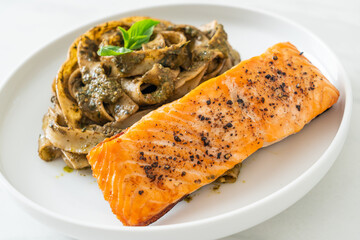 pesto fettuccine spaghetti pasta with grilled salmon fillet