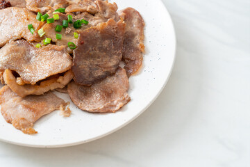 grilled pork neck sliced on plate