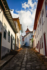 Fototapeta na wymiar A steep cobblestone street on the historic, World Heritage-listed, centre of the town of Diamantina, Minas Gerais, Brazil