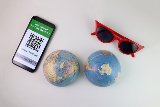 Vaccine passport smartphone app red sunglass world atlas globe map north south pole on white background world travel tour vacation