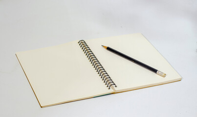 Notebook and Pencil Isolated on White Background.