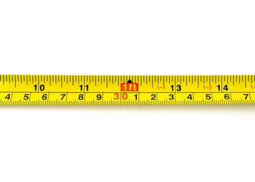 Measuring tape with centimeters and inches isolated on white background.