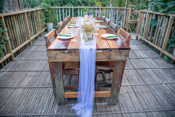 dining table with chair made of wood on the outside