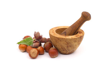 Hazelnuts and wooden rustic-style mortar and pestle