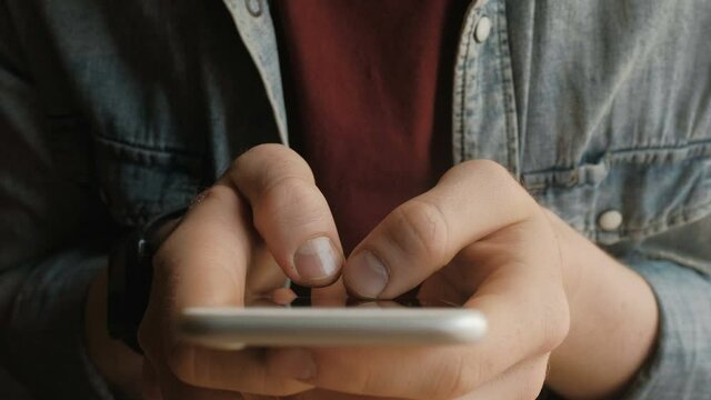 Fingers tapping on smart phone screen