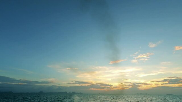 Sunset o r sunrise on cyan blue sky over sea water n ocean wave